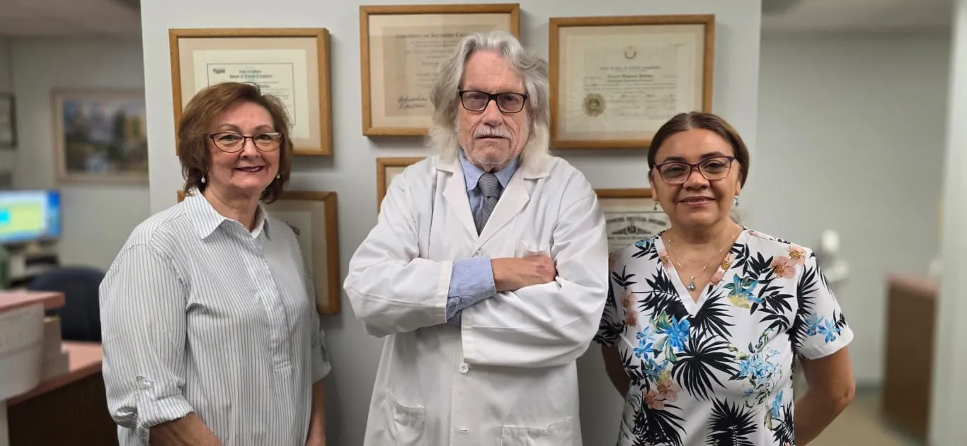 Dr. Baldwin's dental team with a happy patient at HB Dentist Huntington Beach