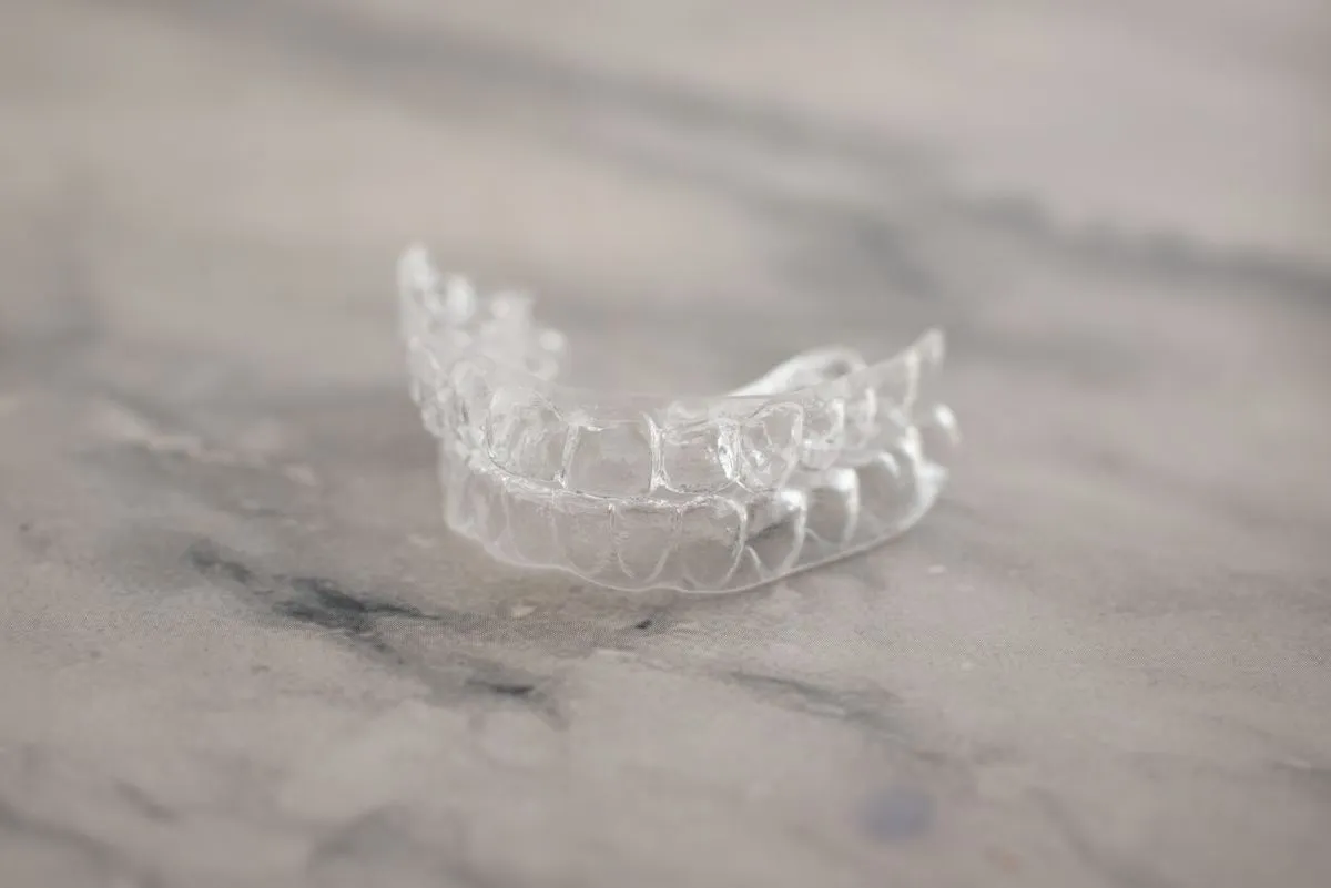 Clear aligner trays used in Invisalign treatment for straighter teeth