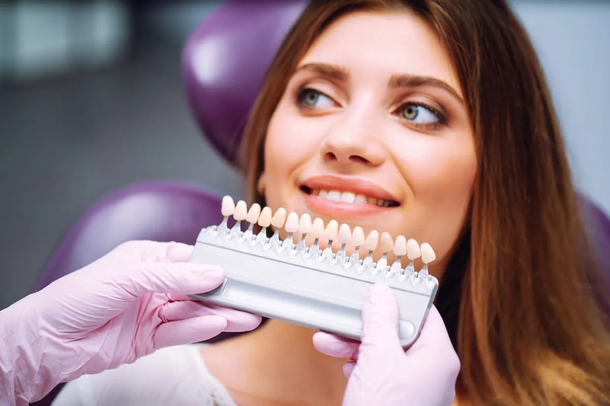 Confident woman showing off her stunning cosmetic dentistry results